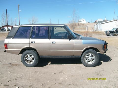 1991 Land Rover Range Rover - This 1991 Land Rover Range Rover is seen from the side under a clear blue sky.