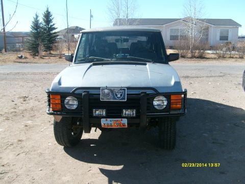 1991 Land Rover Range Rover - This Land Rover Range Rover is parked outside a house on a sunny day.
