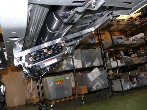 Undercarriage view of a vehicle's fuel tank and suspension system
