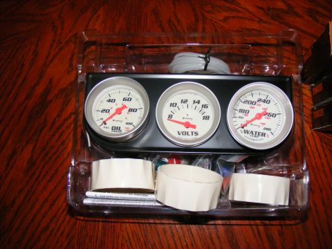 1978 Ford Bronco - This is a gauge cluster oil pressure, volts, and water temperature gauges, along with associated wiring and mounting hardware.