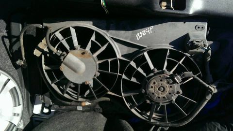 2000 Mercury Grand Marquis - Radiator fan assembly, possibly from a Mercury Grand Marquis, with a visible part number.