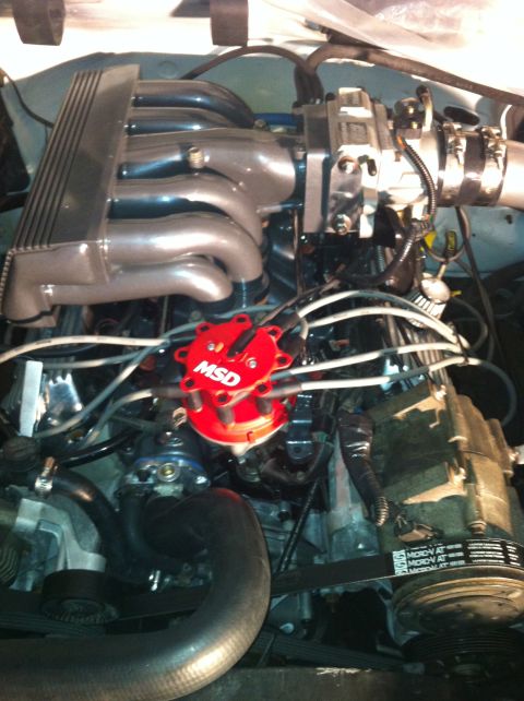 1992 Ford Bronco - Close-up of an engine bay, focusing on the MSD distributor and intake manifold.