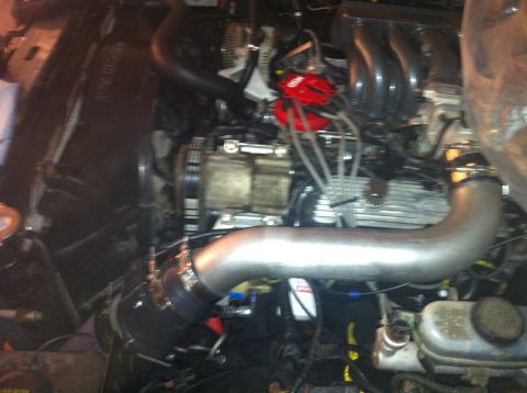 1992 Ford Bronco - Close-up view of an engine bay, showing various components and wiring.