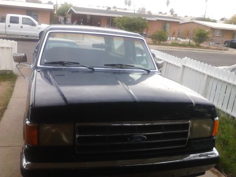 1990 Ford Bronco - This 1990 Ford Bronco is seen from the front in a residential driveway.