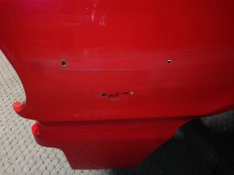 1964 Ford Fairlane - A section of a red vehicle body shows areas marked for repair, including a spot labeled 'Fill'.