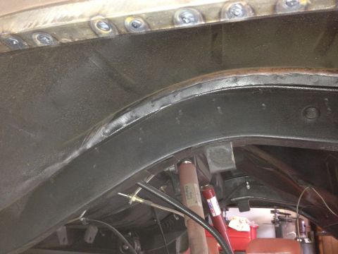 1964 Ford Fairlane - Underbody view showing frame rail, suspension, and shock absorber.