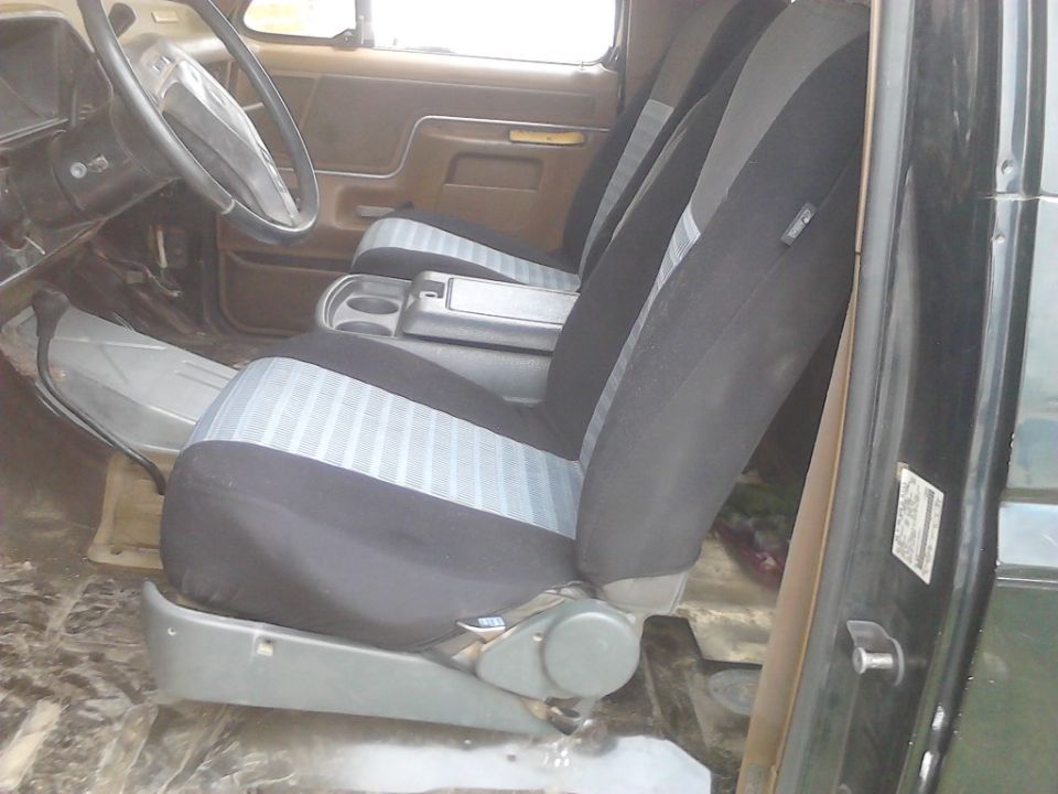 found some seats in better condition and put seat covers on them(driver side)