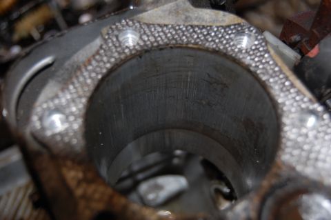 2006 Honda RANCHER - Close-up view of an engine cylinder showing internal cross-hatching and surrounding gasket material.