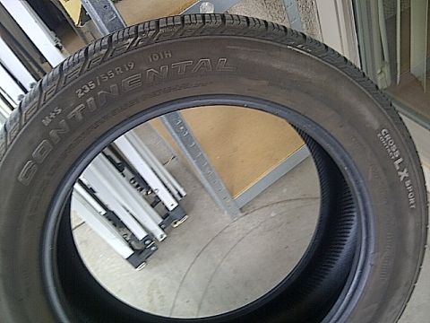 1993 Ford Probe - A close-up view of a Continental tire, showing its tread and sidewall markings.