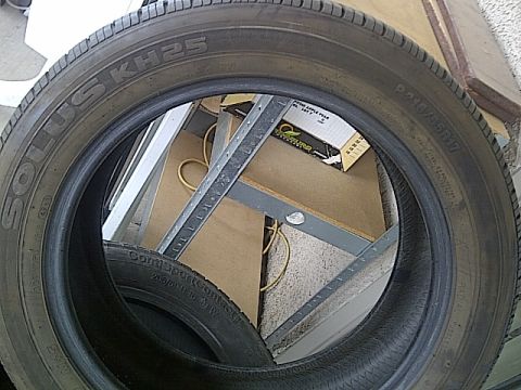 1993 Ford Probe - A close-up view of a tire, revealing its brand and model information.