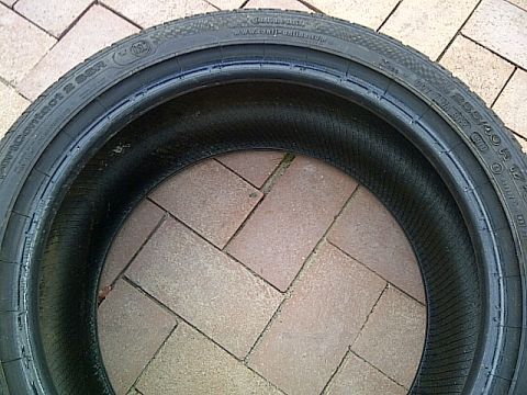 1993 Ford Probe - Close-up of a Continental SportContact 2 tire, size 255/40 R 17, on a brick surface.