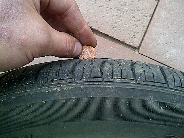 Tire tread depth measured with a penny
