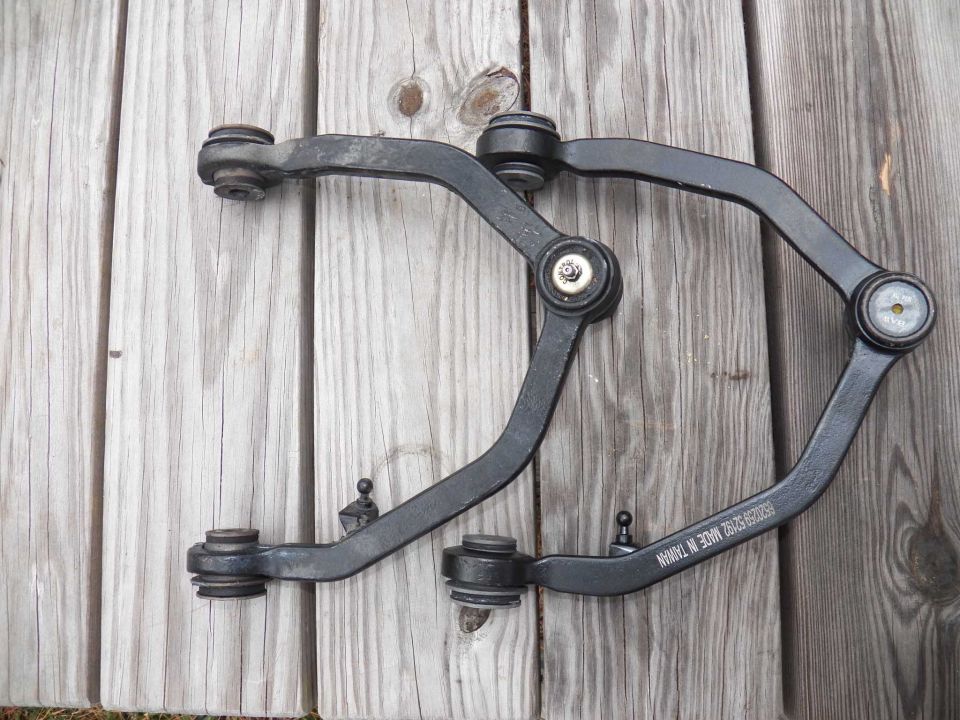 Front suspension control arms with "MADE IN TAIWAN" text visible