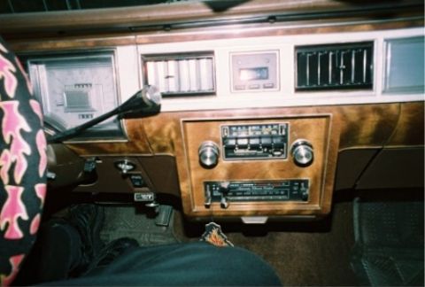 1984 Mercury Grand Marquis - Dashboard of a 1984 Mercury Grand Marquis, woodgrain trim and an analog instrument cluster.