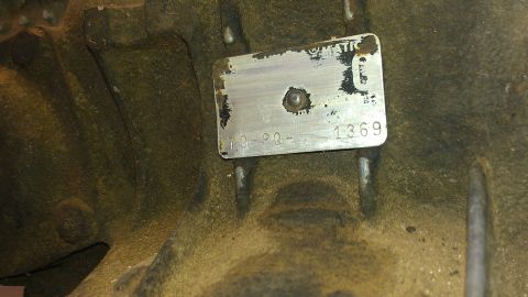 1970 Pontiac Trans Am - A close-up view of a stamped metal tag on a vehicle's engine block, showing the year 1970.