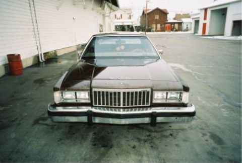 1984 Mercury Grand Marquis - Front view of a 1984 Mercury Grand Marquis parked in an outdoor lot.