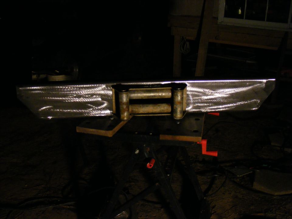 Custom steel bumper with winch mounted on a table