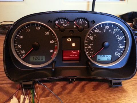 2002 Volkswagen Jetta - The instrument cluster from a 2002 Volkswagen Jetta is shown with various gauges and a digital display.