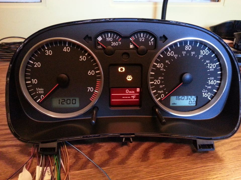 2002 Volkswagen Jetta instrument cluster with odometer showing 160322 miles