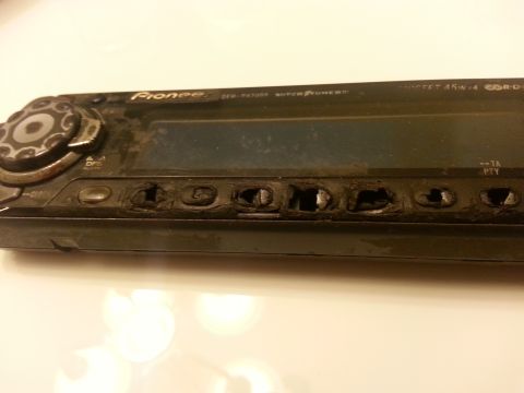1995 Ford Bronco - Close-up of a dusty Pioneer car stereo unit, showing worn buttons and a dark display screen.