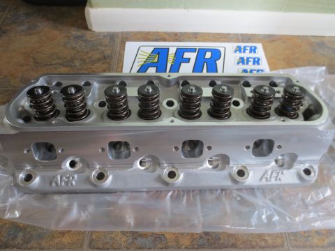 1996 Ford Bronco - A close-up of an AFR cylinder head, showing the valve springs and AFR branding.