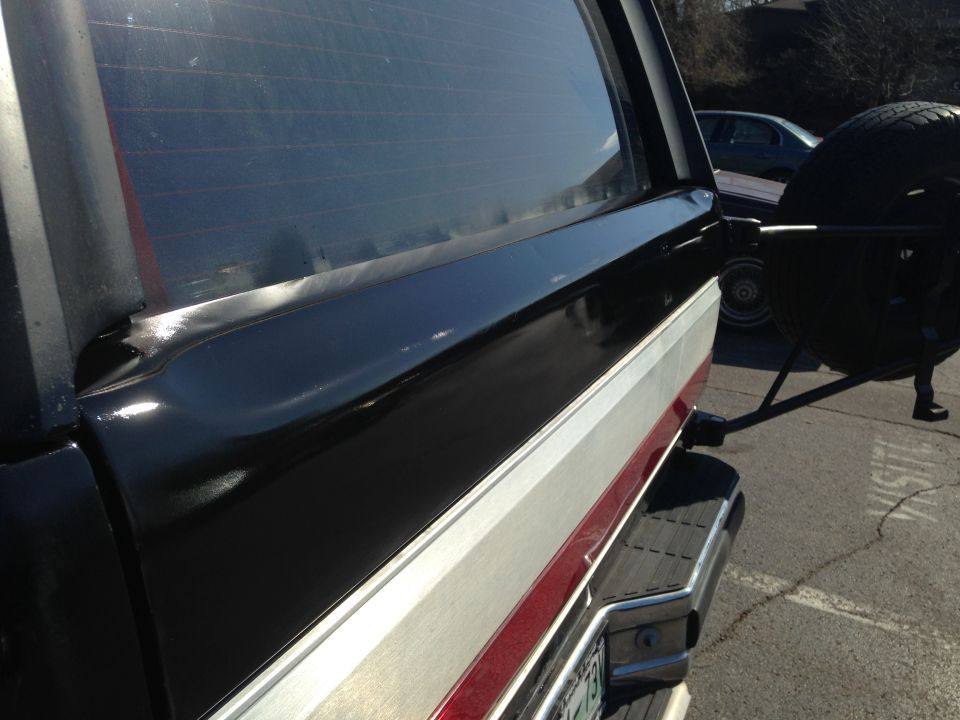 Black and silver Ford Bronco rear with spare tire mount and chrome bumper