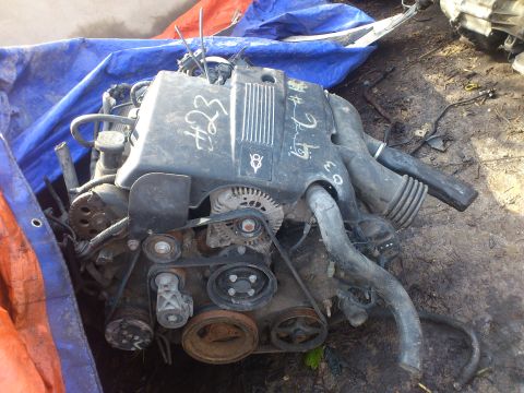 1998 Ford Crown Victoria - Engine part, likely from a V8, with handwritten numbers '#23' and '#2.9' visible on the cover.