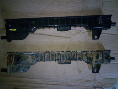 1998 Ford Crown Victoria - Comparison of a new radiator support bracket with an old, corroded one.