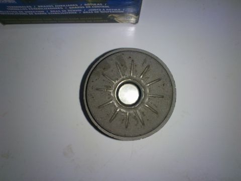 1998 Ford Crown Victoria - A close-up view of an upper control arm bushing, a component for vehicle suspension systems.