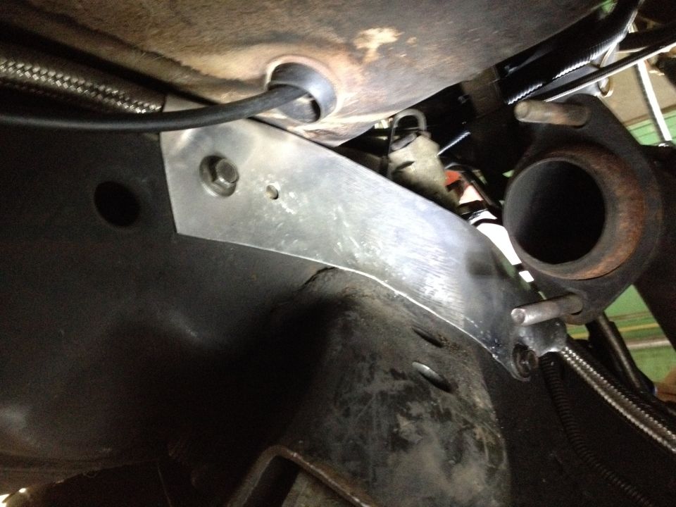 I rerouted the fuel line through the front crossmember but it turned out that the new route was closer to the exhaust than I like so i made this quick aluminum heat shield / bracket.