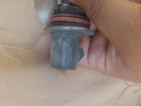 1998 Ford Crown Victoria - A Sylvania HB5/9007 DOT headlight bulb is shown, manufactured in the USA.