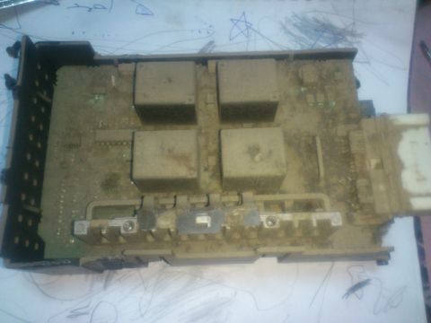1998 Ford Crown Victoria - This image shows an automotive fuse box, likely from a vehicle, with visible relays and electrical connectors.