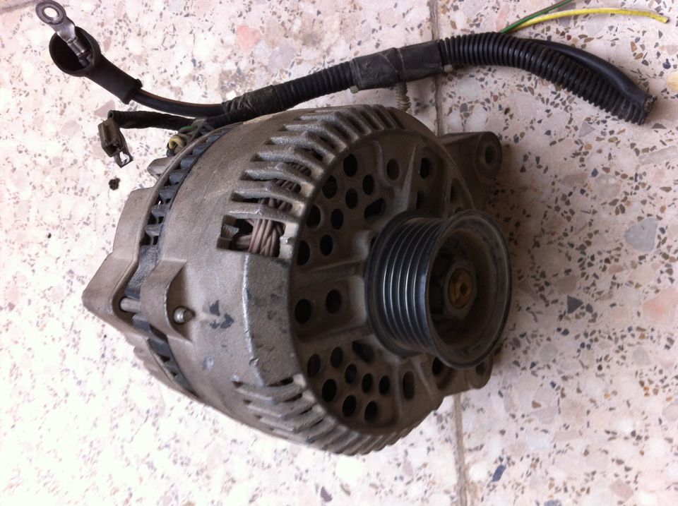 Automotive alternator with pulley and wiring harness attached