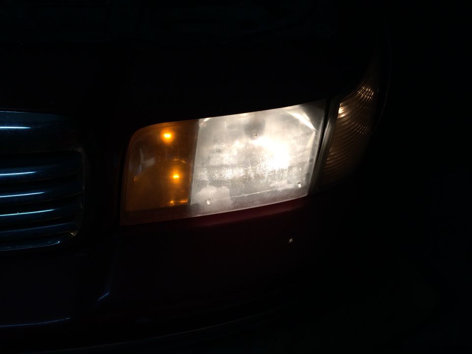 1998 Ford Crown Victoria headlight assembly with amber turn signal and clear main beam