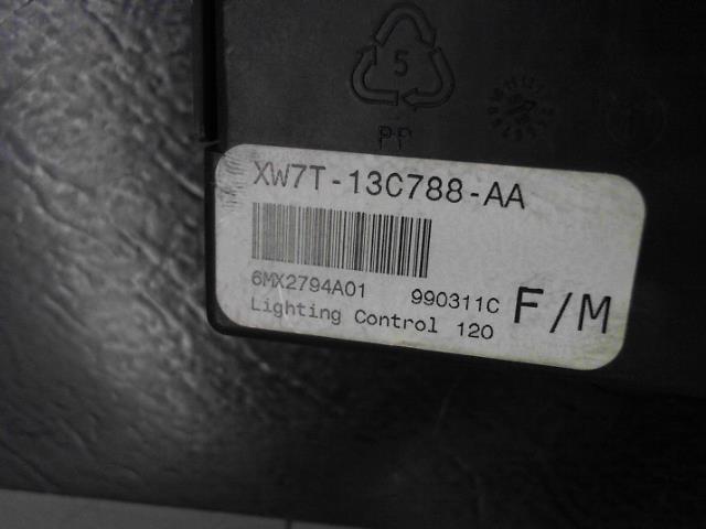 Black lighting control module part with label XW7T-13C788-AA