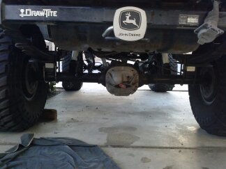 1995 Ford Bronco - Undercarriage view of a modified truck's rear axle and suspension components.