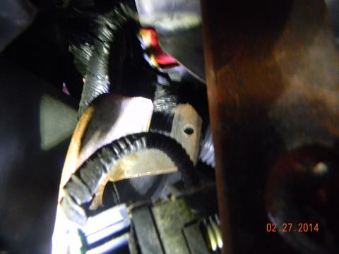 1995 Ford Bronco - this is stock bracket for shifter cable, to remove cable you push a screwdriver into the hole to release the cable then push up and out of…