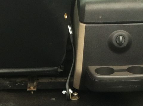 1982 Ford Bronco - Close-up of vehicle interior showing seat and center console details.