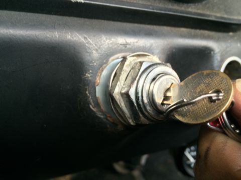 1964 Ford Ranchero - Ignition switch with key inserted, showing wear and tear on the dashboard.