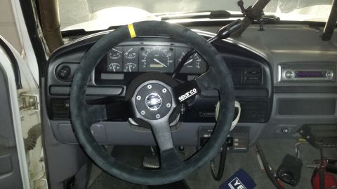 1996 Ford Bronco - Interior view of a vehicle's dashboard and steering wheel, with aftermarket modifications visible.