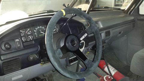 1996 Ford Bronco - Interior view of a 1996 Ford Bronco, a Sparco steering wheel and aftermarket gauges.