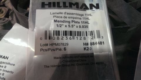 2000 Mercury Grand Marquis - A close-up view of a package containing Hillman Mending Plates, with product details and a barcode visible.