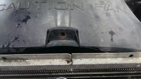 2000 Mercury Grand Marquis - The fan shroud has 'CAUTION FAN' printed on it, indicating a part of the cooling system.