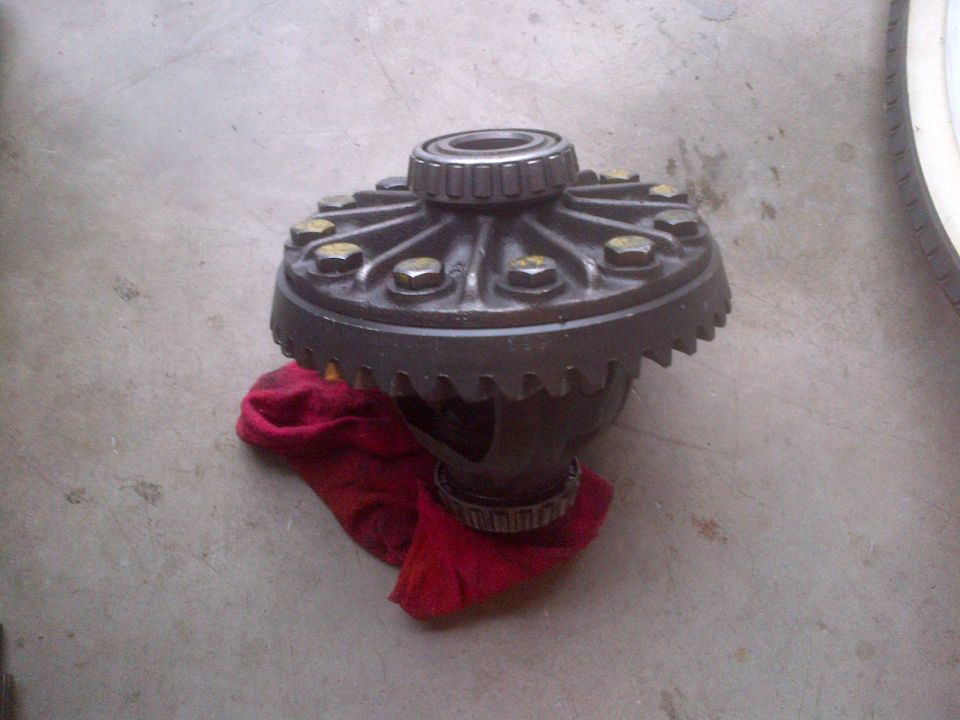 Differential carrier with bearings sitting on a red cloth