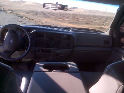 1985 Jeep CJ7 - Interior view of a Ford truck, showing the dashboard, steering wheel, and center console.