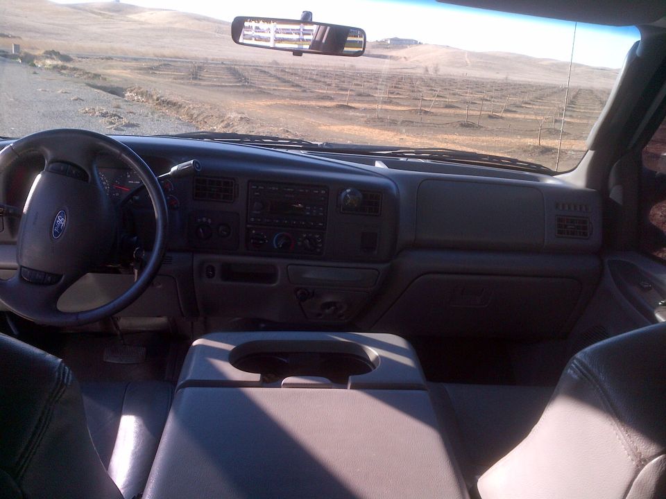 Interior view of a Ford truck, showing the dashboard, steering wheel, and center console
