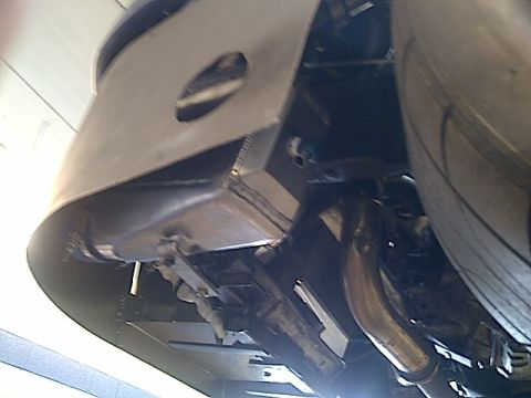 1995 Ford Probe - The photo shows the underside of a vehicle, focusing on the exhaust pipes and frame components.