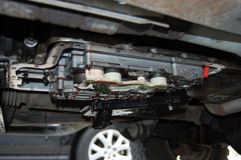 1994 Ford Bronco - Transmission valve body showing circuit board and fluid leaks. Part number 500914 is visible.
