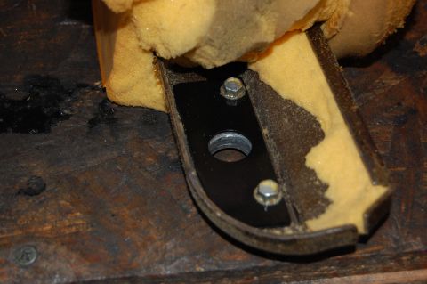 1994 Ford Bronco - Close-up of a car armrest part undergoing repair, showing foam and metal components.