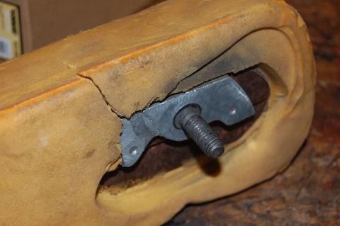 1994 Ford Bronco - Close-up of damaged armrest foam showing a metal bracket and bolt, with text from Supermotors.net visible.